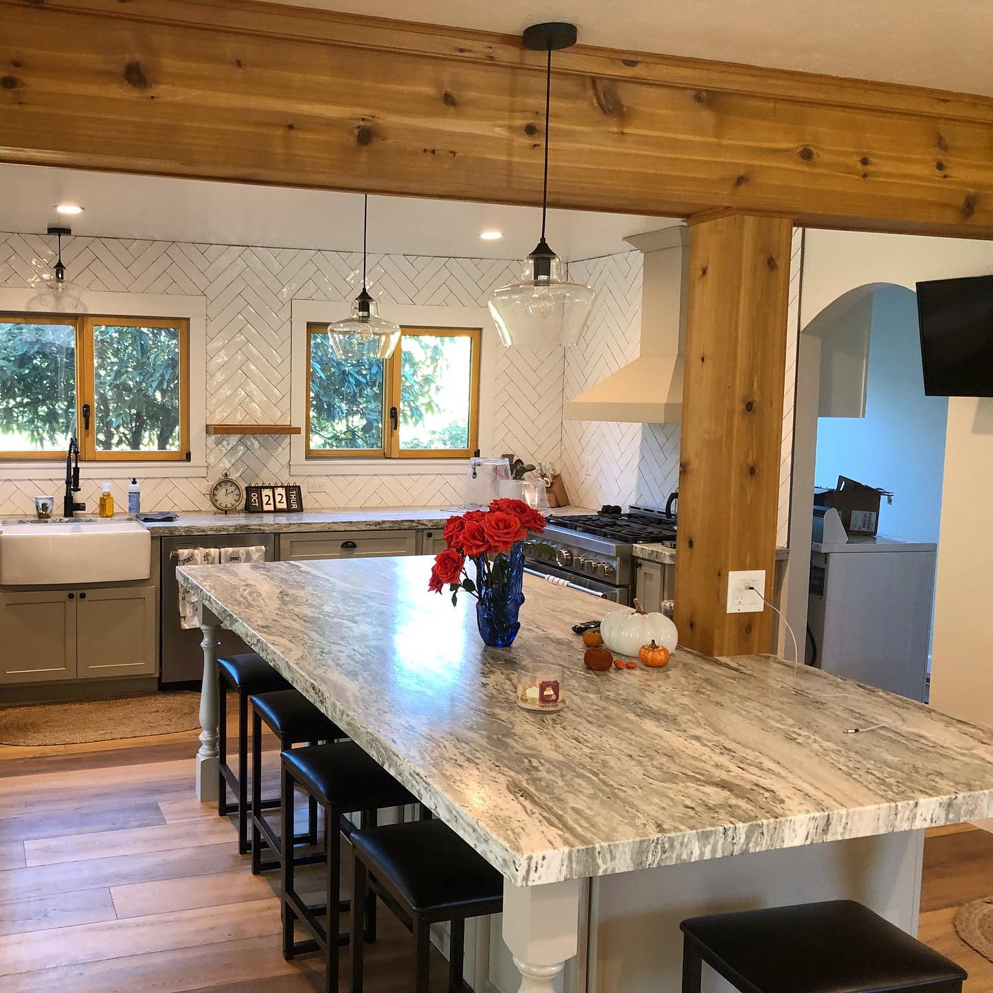 Farmhouse kitchen remodel with exposed beams and farmhouse sink by Mills Builds Inc. in Humboldt County CA.